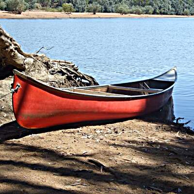 Canoe A canoe on the river bank